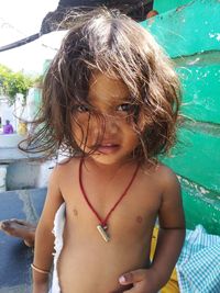 Close-up portrait of shirtless girl