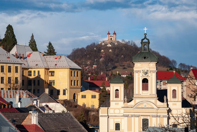 Buildings in city against sky