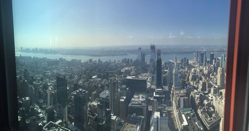 High angle view of city buildings against sky