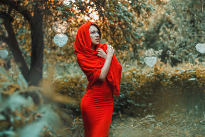 Woman standing in forest