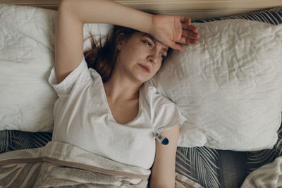 Young woman sleeping on bed at home