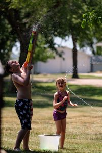 Full length of shirtless boy in water