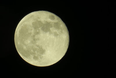 Low angle view of full moon at night