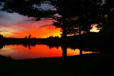 Scenic view of lake at sunset