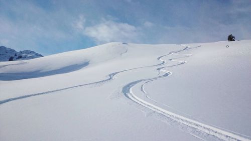 Snow covered mountain against sky