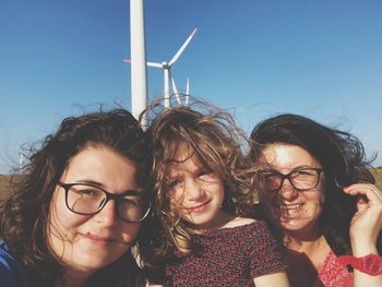 Portrait of smiling family against sky