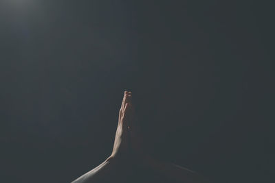 Close-up of light bulb against black background