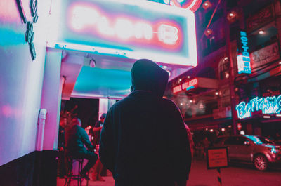 Man in illuminated room