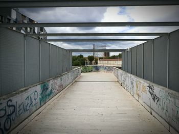 Empty walkway leading to building