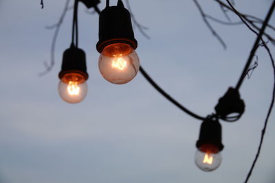 Low angle view of illuminated light bulb