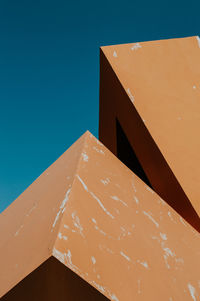 Low angle view of building against blue sky