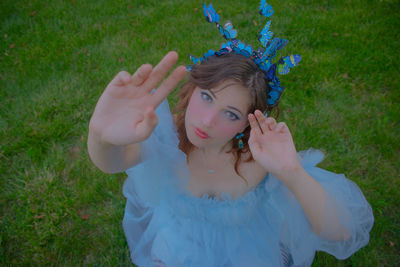 Portrait of young woman holding flower