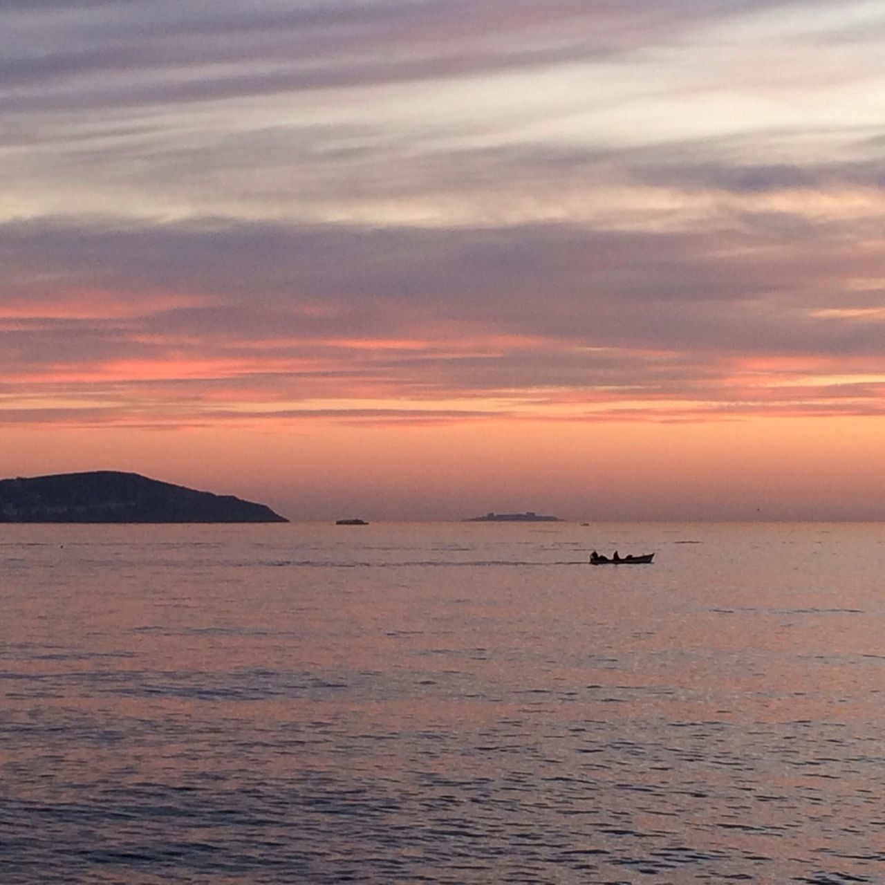 sunset, sea, water, scenics, tranquil scene, sky, tranquility, beauty in nature, waterfront, orange color, nautical vessel, horizon over water, nature, idyllic, boat, cloud - sky, rippled, transportation, silhouette, cloud