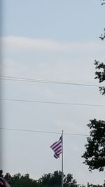 Low angle view of flag against sky