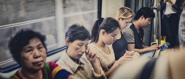 Close-up of young woman sitting with text