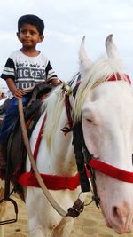 Portrait of a man riding horse