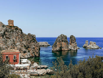 Scenic view of sea against clear blue sky