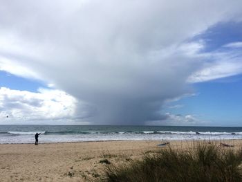 Scenic view of sea against cloudy sky