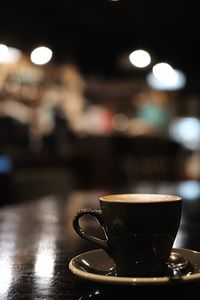 Close-up of coffee cup on table