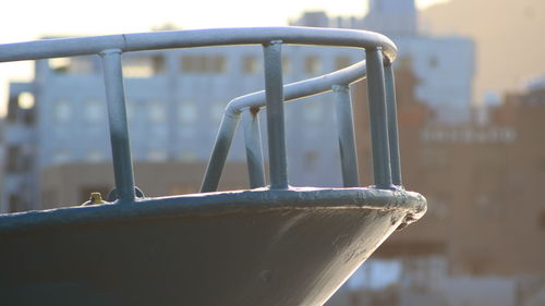 Close-up of playground against railing