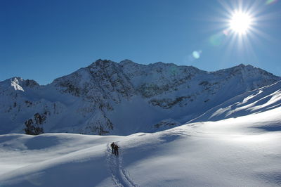 Scenic view of snowcapped mountain against sky