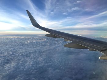 Scenic view of aircraft wing through window