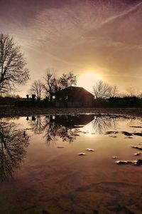 Scenic view of lake against sky during sunset