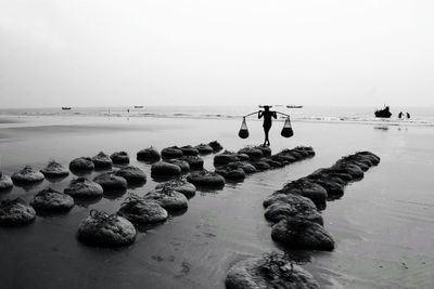 Scenic view of sea against cloudy sky