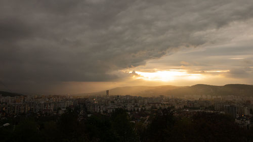 High angle view of buildings against sky at sunset