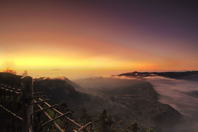 Scenic view of mountains against sky during sunset