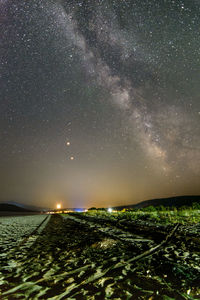 Scenic view of star field against milky way at night during triple planet alignment