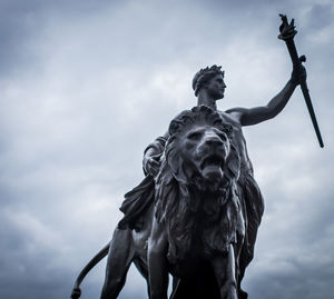 Low angle view of statue against cloudy sky