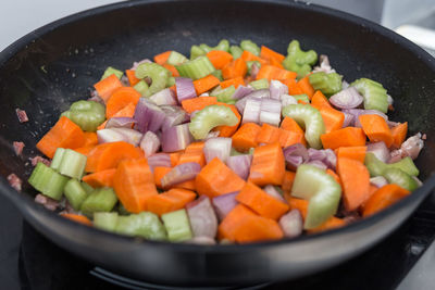 High angle view of chopped vegetables in frying pan