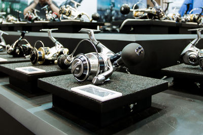 Fishing reels on table in store