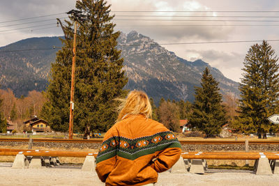 Rear view of woman looking at mountains