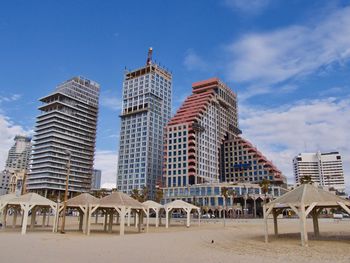 Modern buildings in city against sky