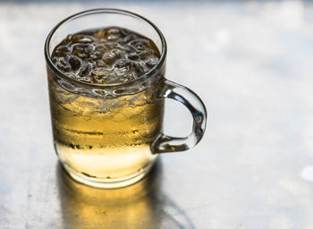 Close-up of beer glass on table