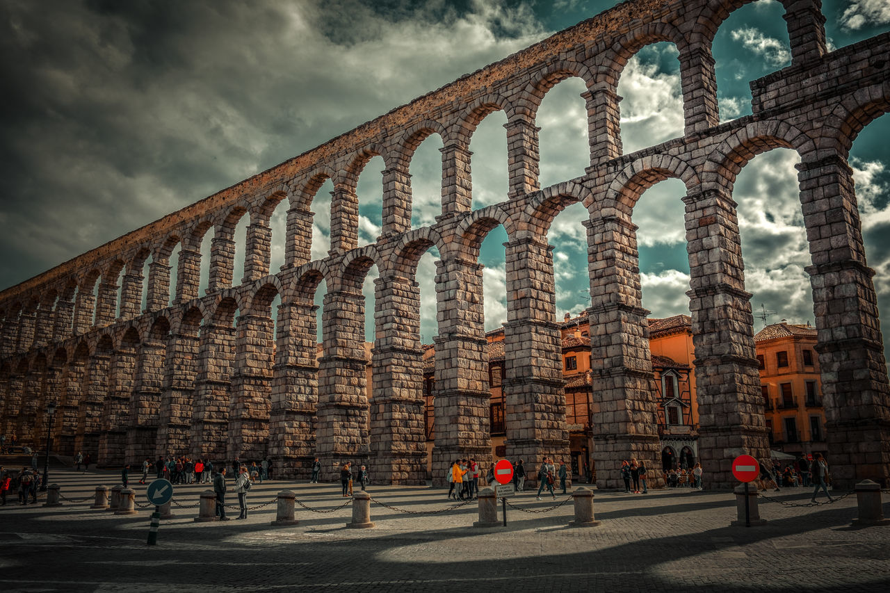 architecture, built structure, landmark, sky, arch, travel destinations, cloud, city, history, building exterior, group of people, the past, travel, nature, cityscape, tourism, urban area, bridge, outdoors, transportation, large group of people, ancient history, crowd, day, ancient