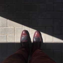 Low section of man standing on floor