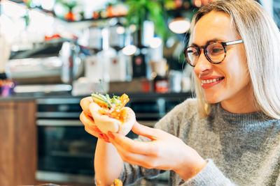 Young woman drinking juice