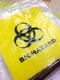 High angle view of yellow drink on table