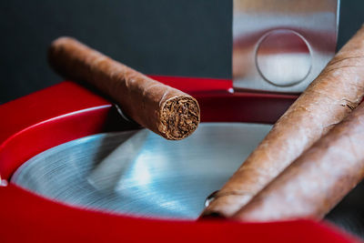 Close-up of cigar on table