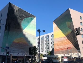 Low angle view of modern buildings against clear sky