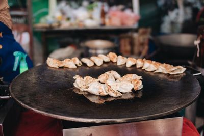 Close-up of hand holding dumping in market