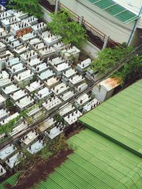 High angle view of buildings and trees in city