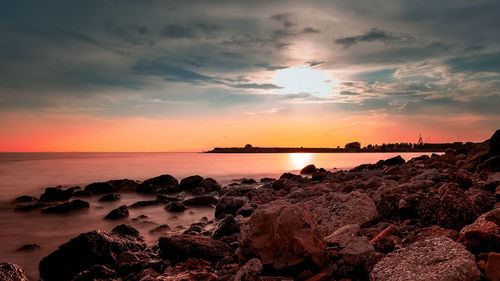 Scenic view of sea against sky during sunset