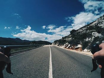 View of road against cloudy sky