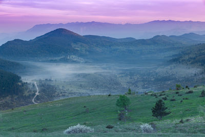 Scenic view of mountains against sky during sunset