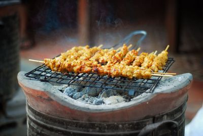 Close-up of food on metal grate