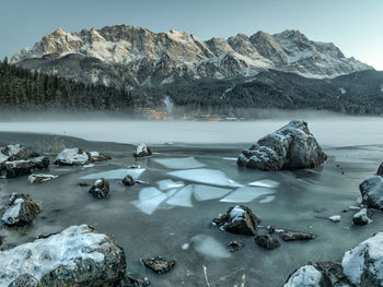 Scenic view of frozen lake against mountain